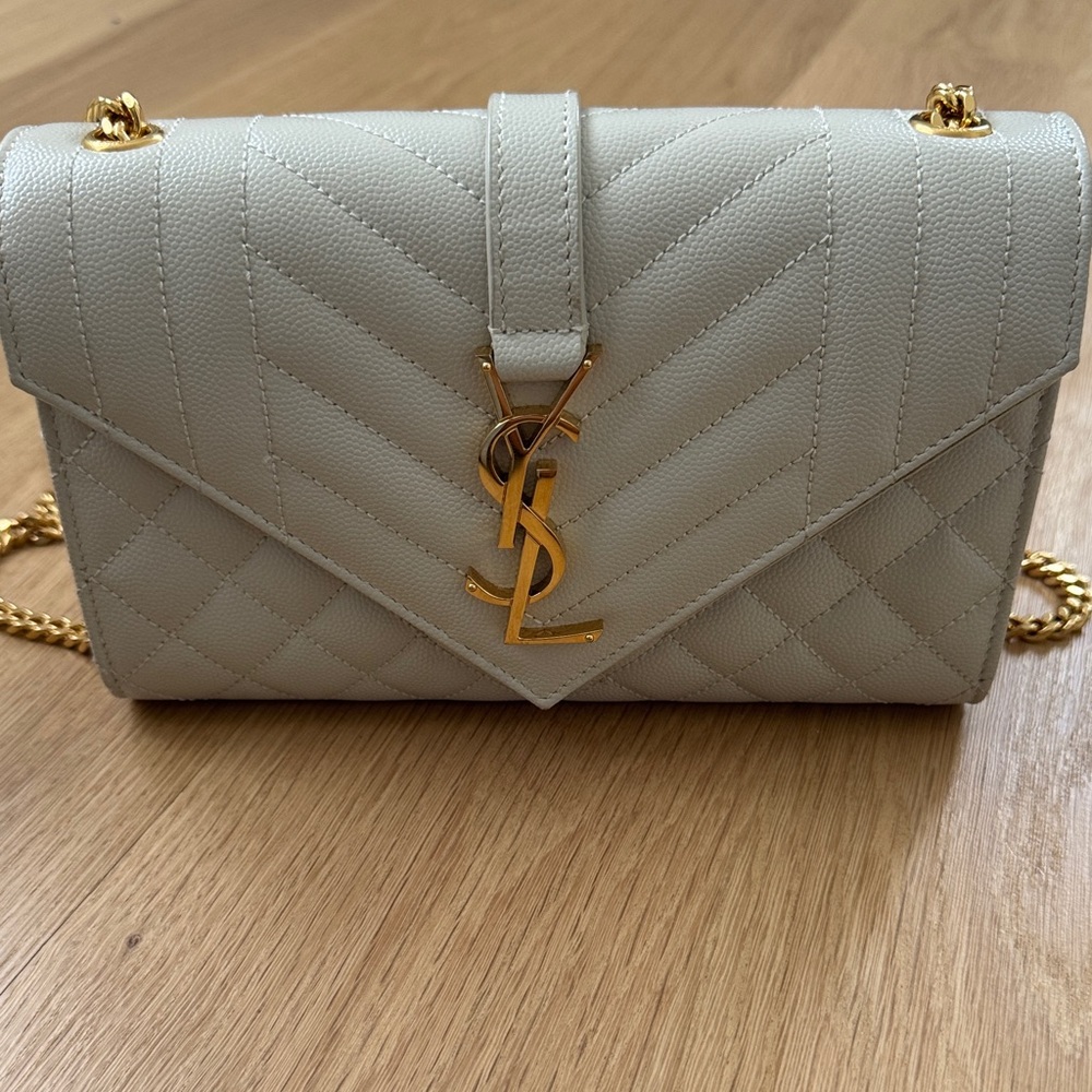 Saint Laurent envelope bag
Wore a handful of times 
Some scratches and stains